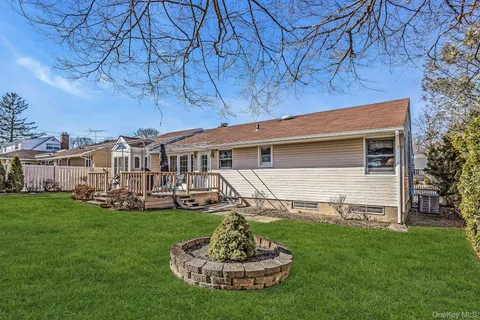 a front view of a house with a yard table and chairs