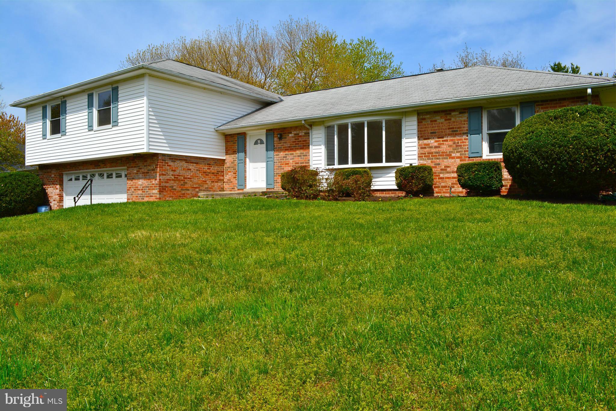 19456 Olney Mill Road Olney, MD 20832 - Photo 1 of 30 a front view of a house with a garden