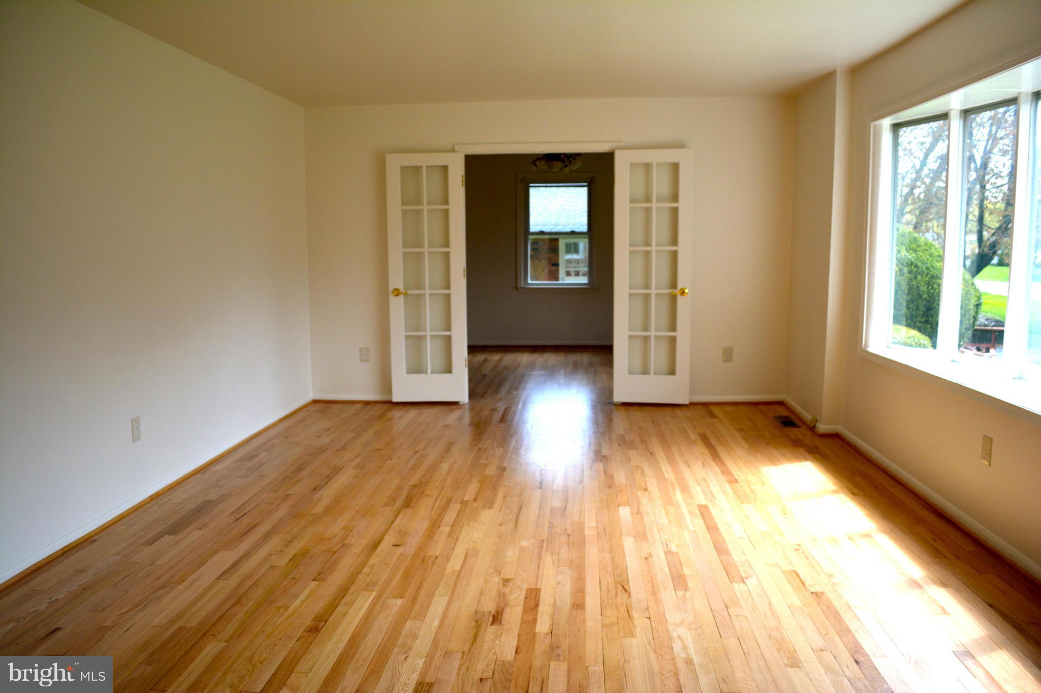 19456 Olney Mill Road Olney, MD 20832 - Photo 5 of 30 a view of wooden floor in an empty room with a window