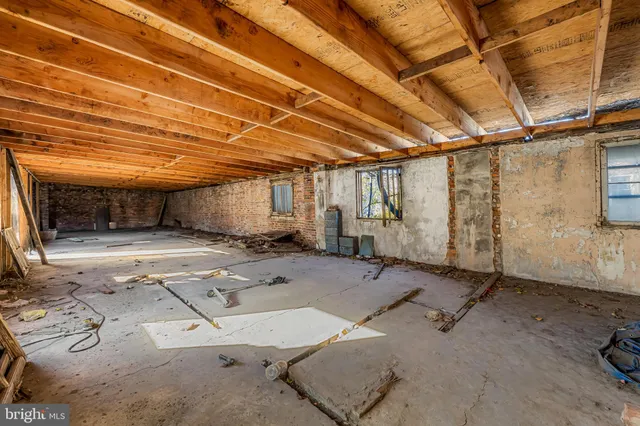 an aerial view of multiple houses with a yard