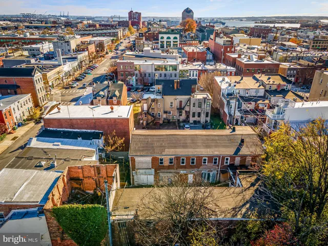 an aerial view of a house with swimming pool