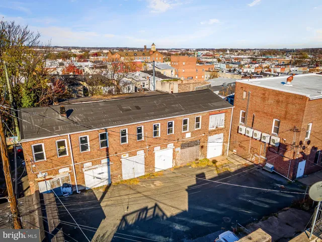 an aerial view of residential building and ocean view