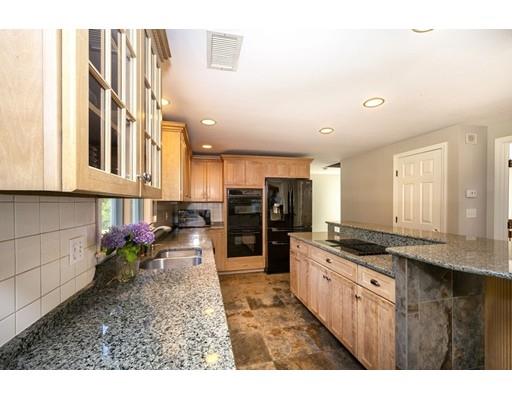 65 Paul Road Hanover, MA 02339 - Photo 14 of 42 a kitchen with stainless steel appliances granite countertop a stove a sink and a refrigerator