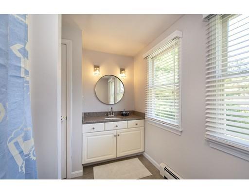 65 Paul Road Hanover, MA 02339 - Photo 36 of 42 a bathroom with a sink a mirror and a window
