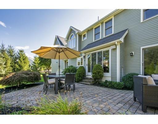 65 Paul Road Hanover, MA 02339 - Photo 7 of 42 a backyard of a house with table and chairs