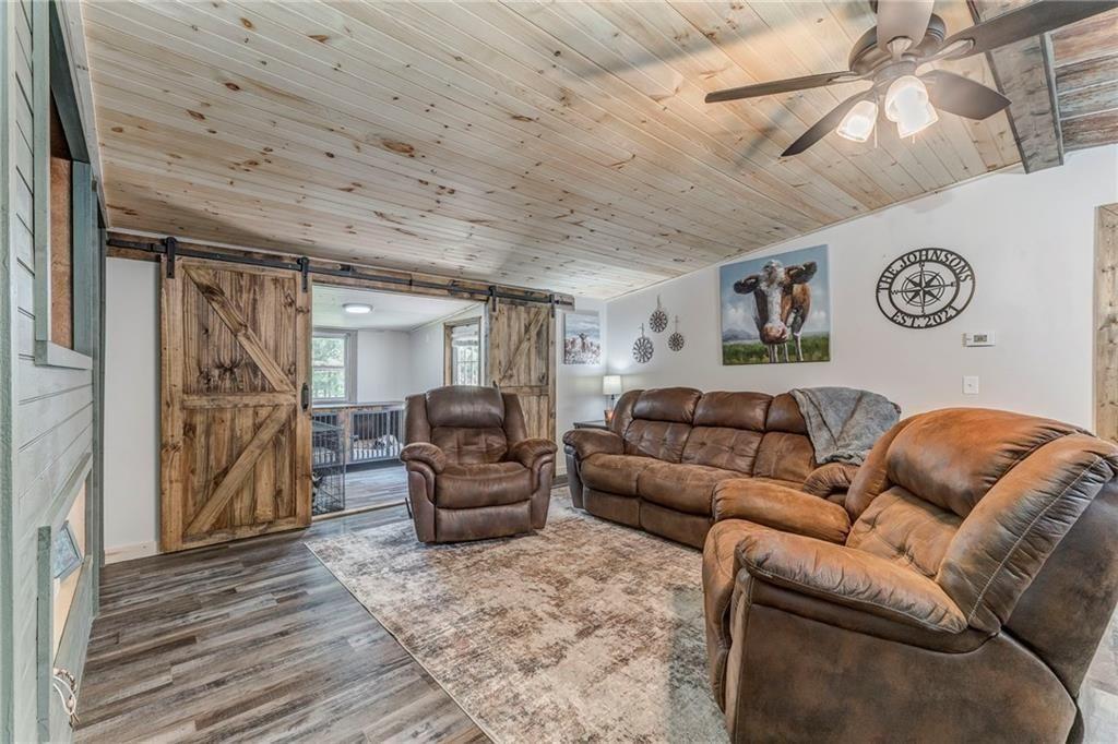 135 Little Creek Lane Resaca, GA 30735 - Photo 22 of 49 a living room with furniture and a ceiling fan