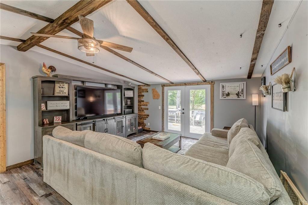 135 Little Creek Lane Resaca, GA 30735 - Photo 27 of 49 a living room with furniture and a flat screen tv