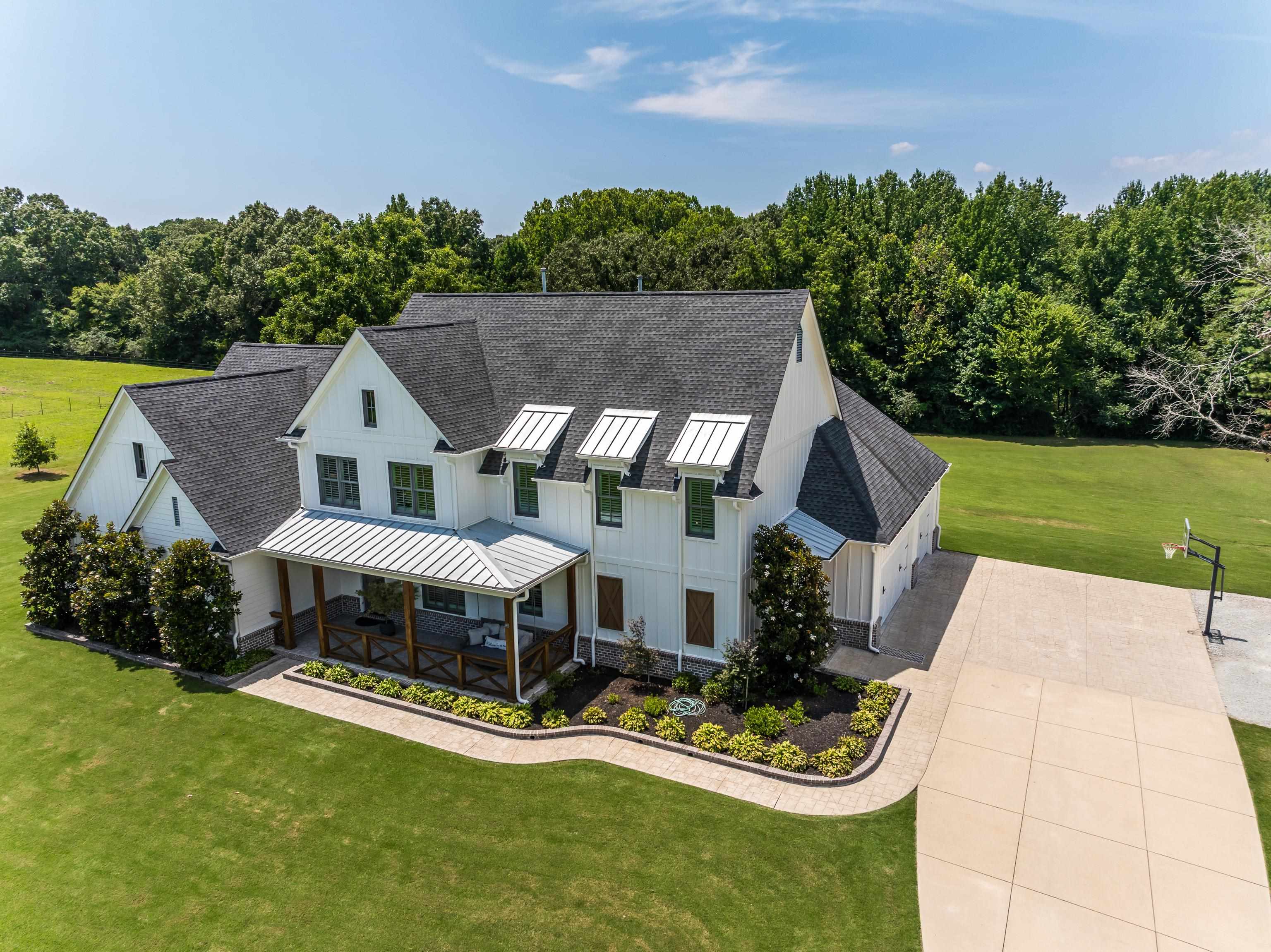 805 Shady Grove Road Williston, TN 38076 - Photo 4 of 40 White siding exterior with black shingle roofing