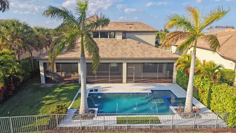 a kitchen with stainless steel appliances granite countertop a refrigerator a stove and a sink with granite countertops