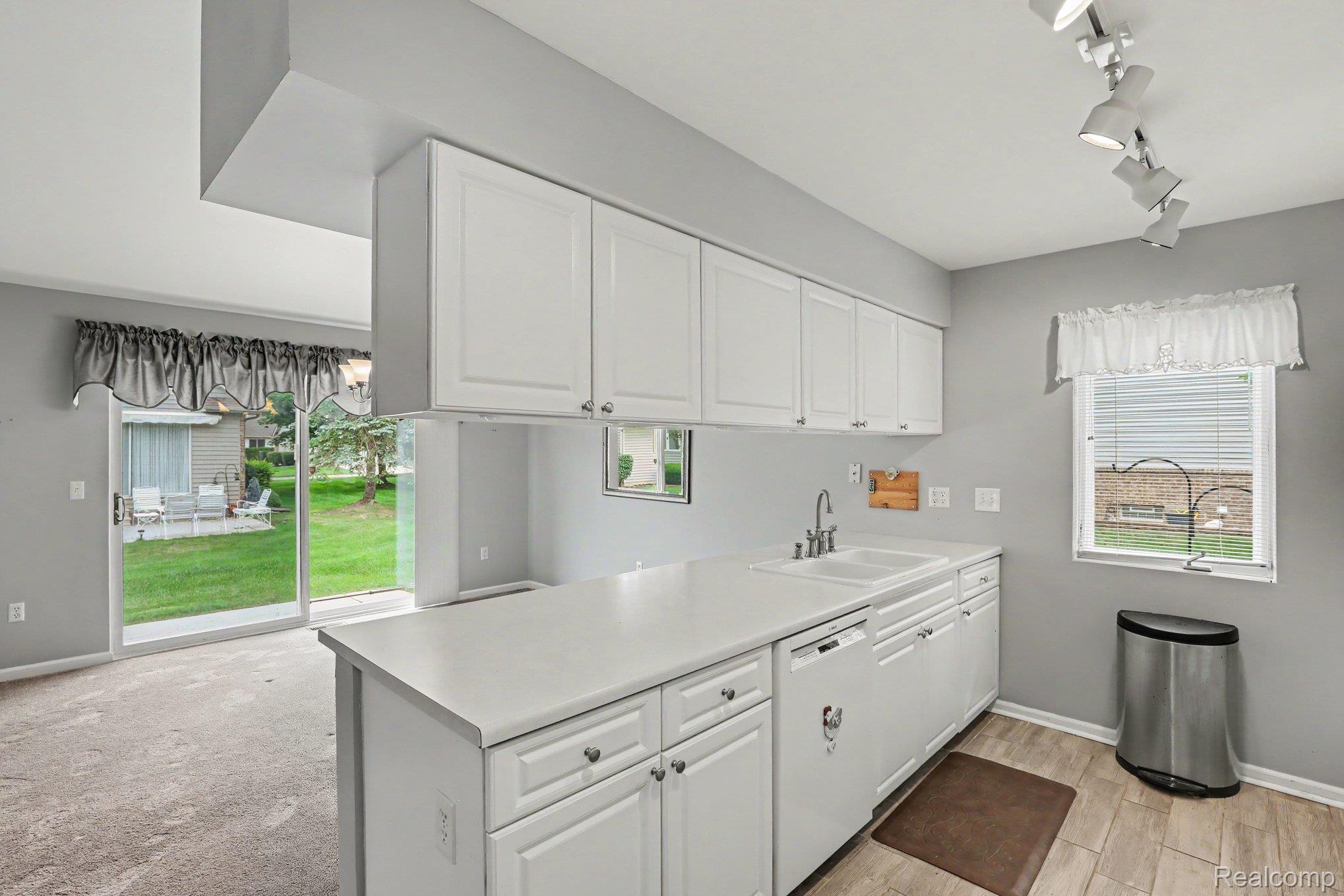 34917 Chickadee Ridge Richmond, MI 48062 - Photo 10 of 32 White cabinetry with brushed nickel hardware
