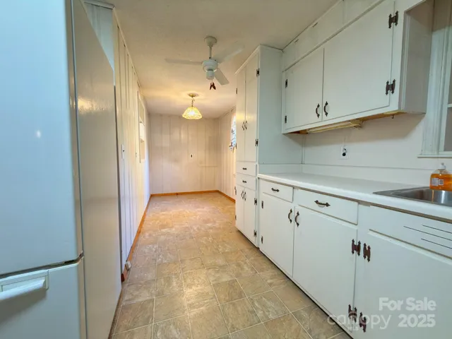 a view of a kitchen with cabinets