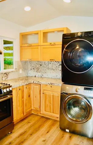 a view of a room with a bathtub and a window