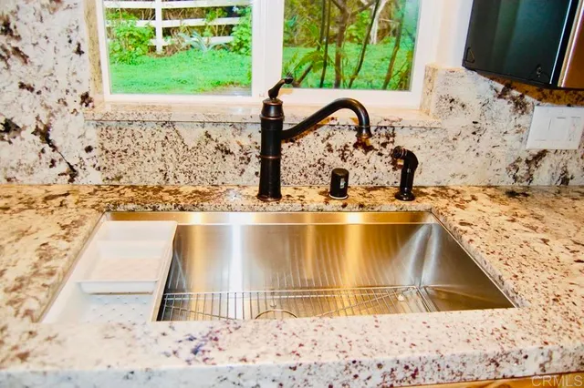 a view of front door with wooden floor