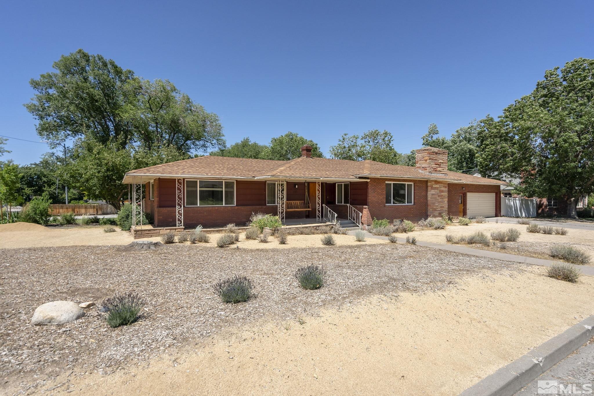 1165 Mt Rose Street Reno, NV 89509 - Photo 2 of 12 a front view of a house with a yard