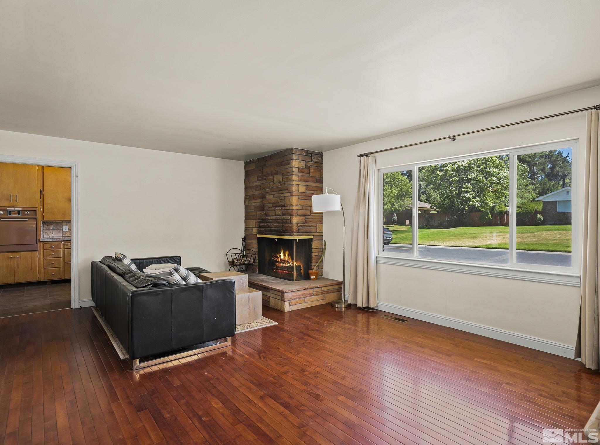 1165 Mt Rose Street Reno, NV 89509 - Photo 3 of 12 a living room with furniture and a flat screen tv