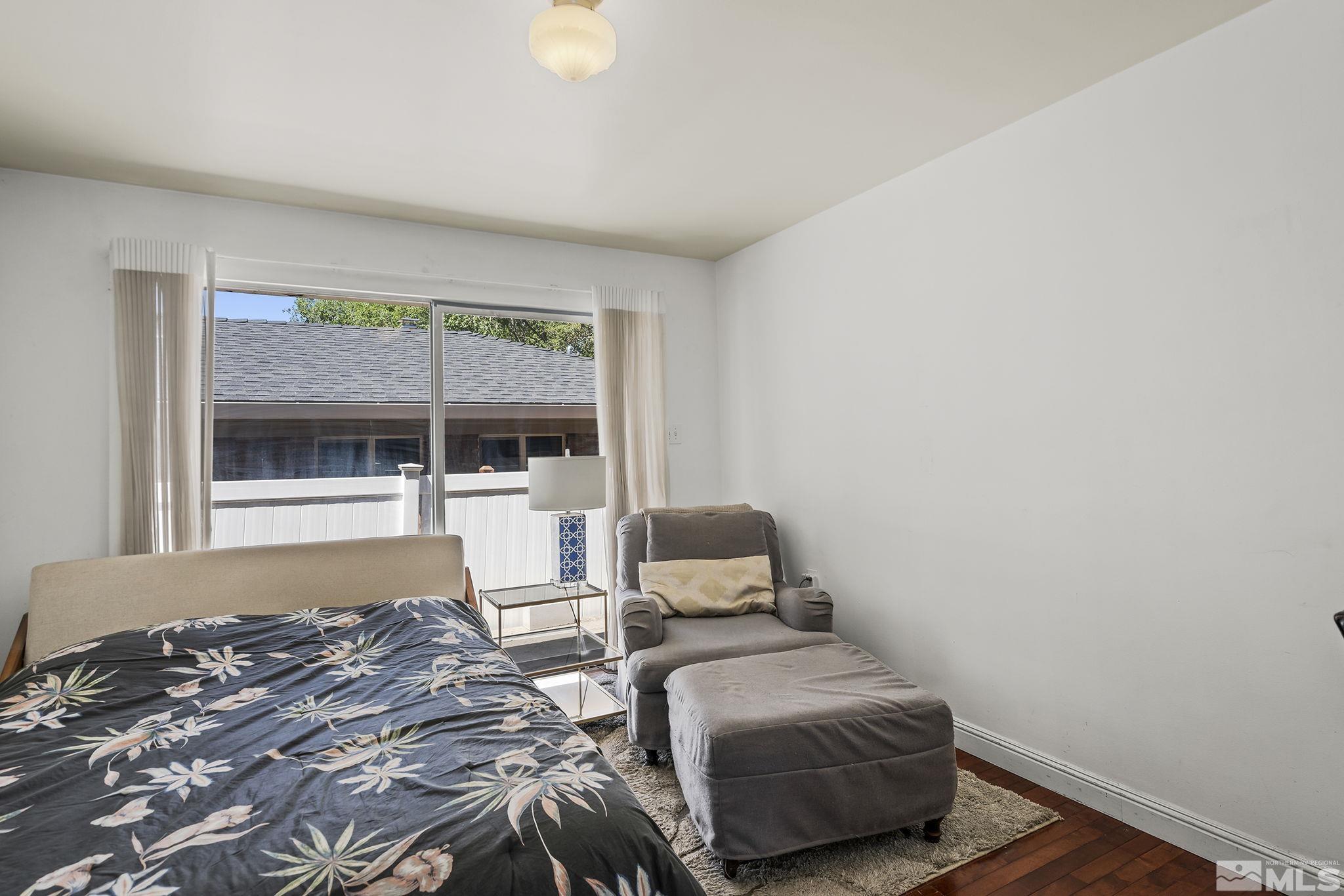 1165 Mt Rose Street Reno, NV 89509 - Photo 10 of 12 a bedroom with a bed and wooden floor