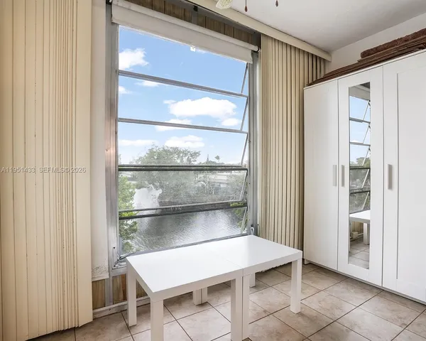 a room with a table and chairs