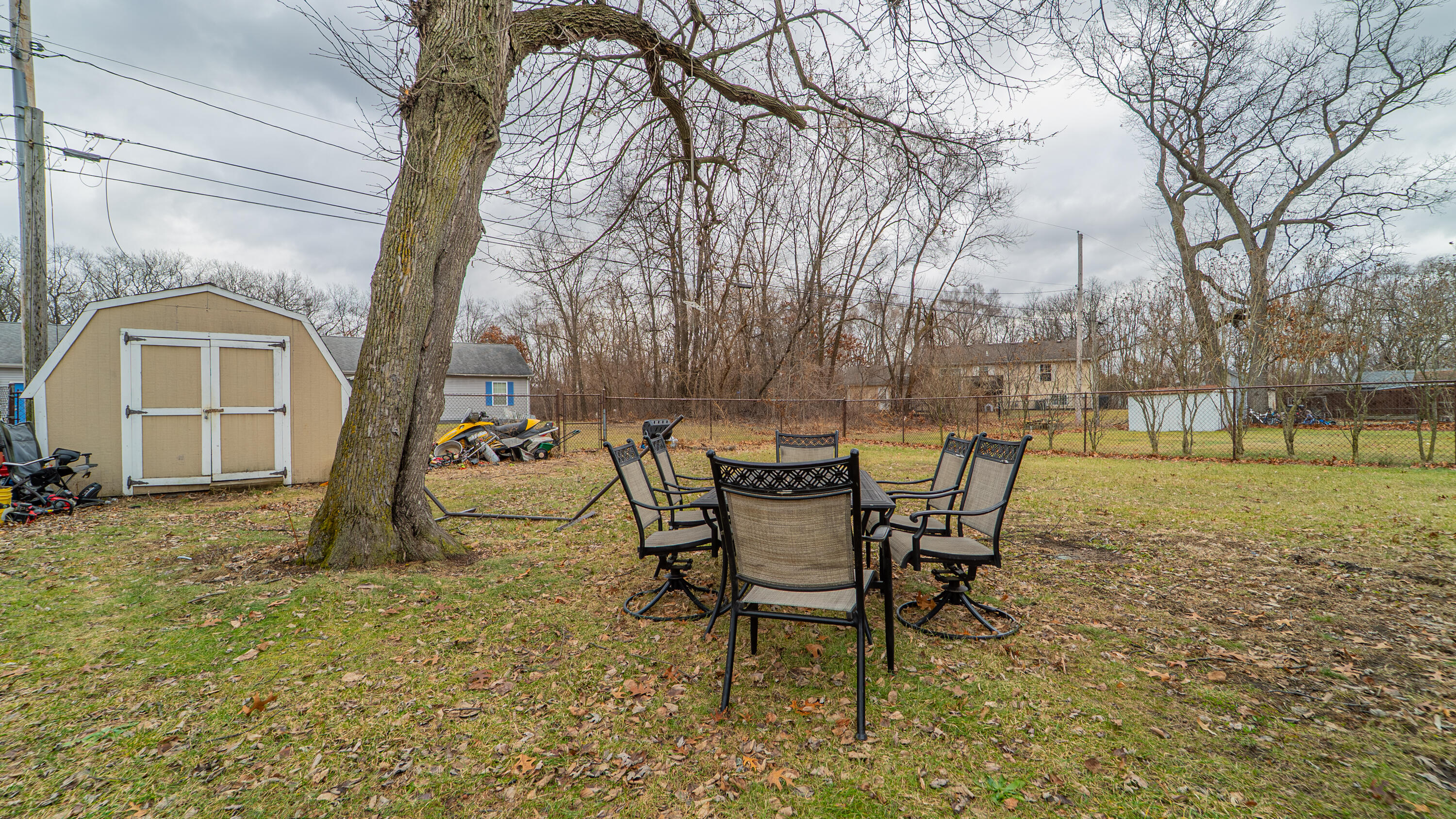3161 Pulaski Street Hobart, IN 46342 - Photo 18 of 22 a view of a backyard with table and chairs and garden