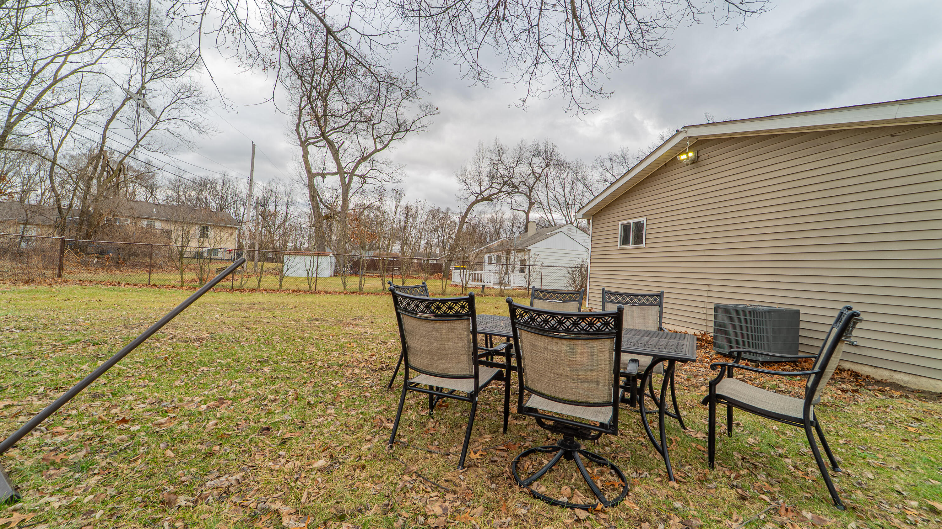 3161 Pulaski Street Hobart, IN 46342 - Photo 21 of 22 a backyard of a house with table and chairs