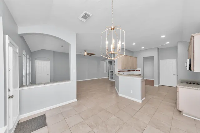 a view of a kitchen with a sink and cabinets
