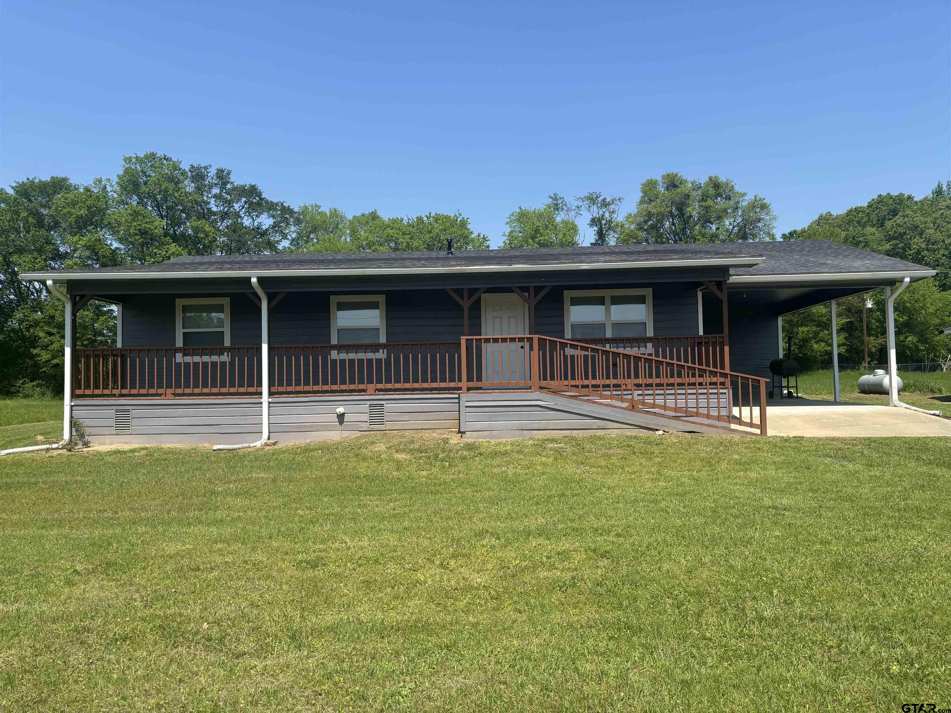 6282 Fm 2245 Pittsburg, TX 75686 - Photo 1 of 13 a swimming pool with outdoor seating and yard