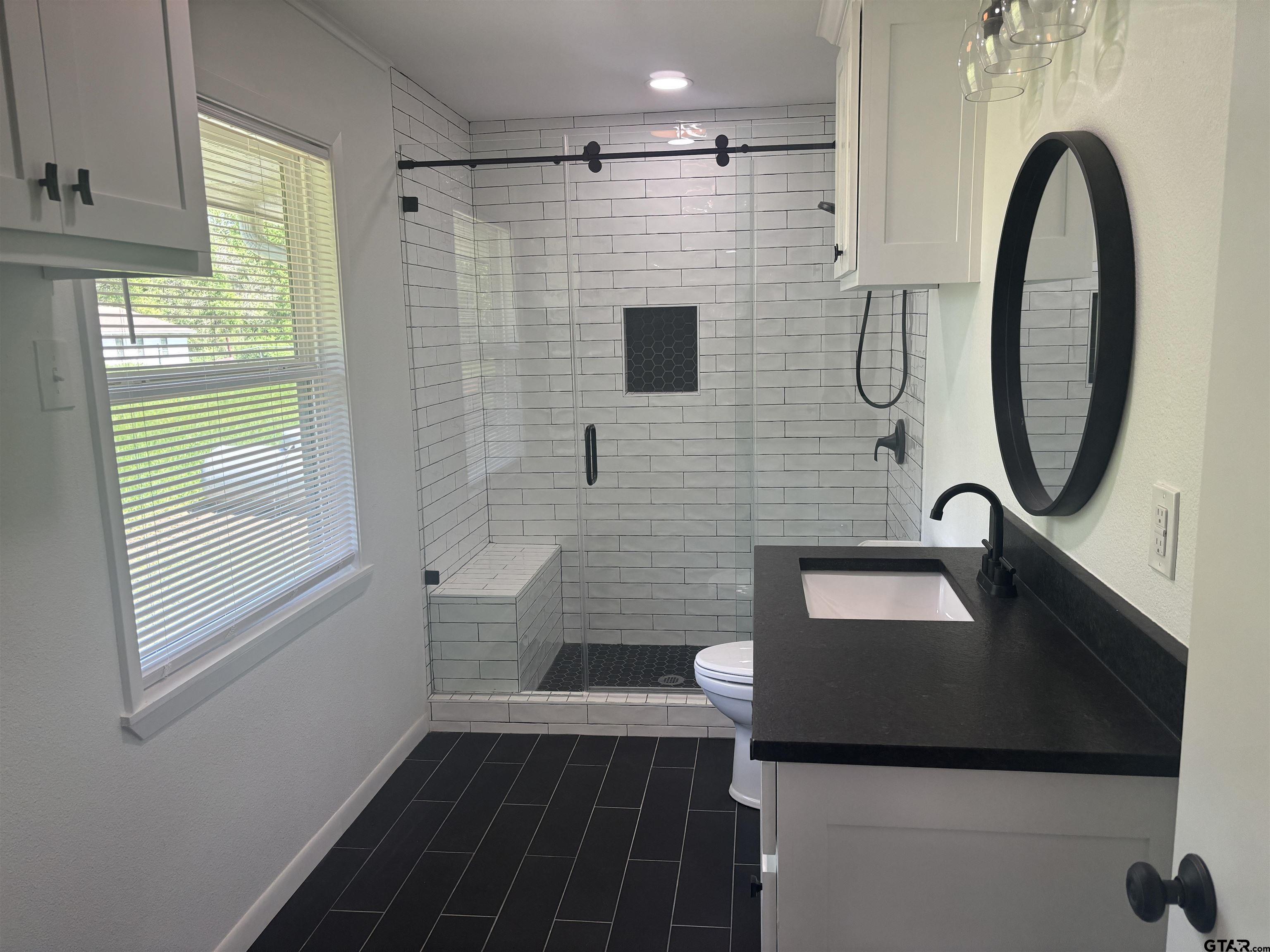 6282 Fm 2245 Pittsburg, TX 75686 - Photo 7 of 13 a bathroom with a sink a toilet and a shower