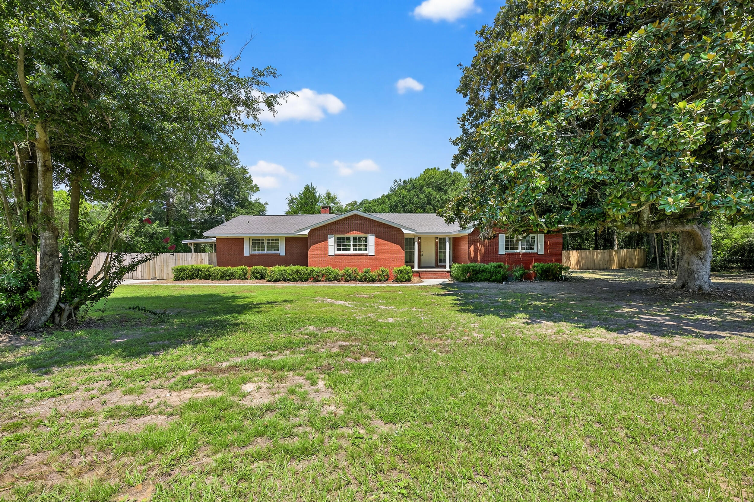 a front view of house with yard and green space