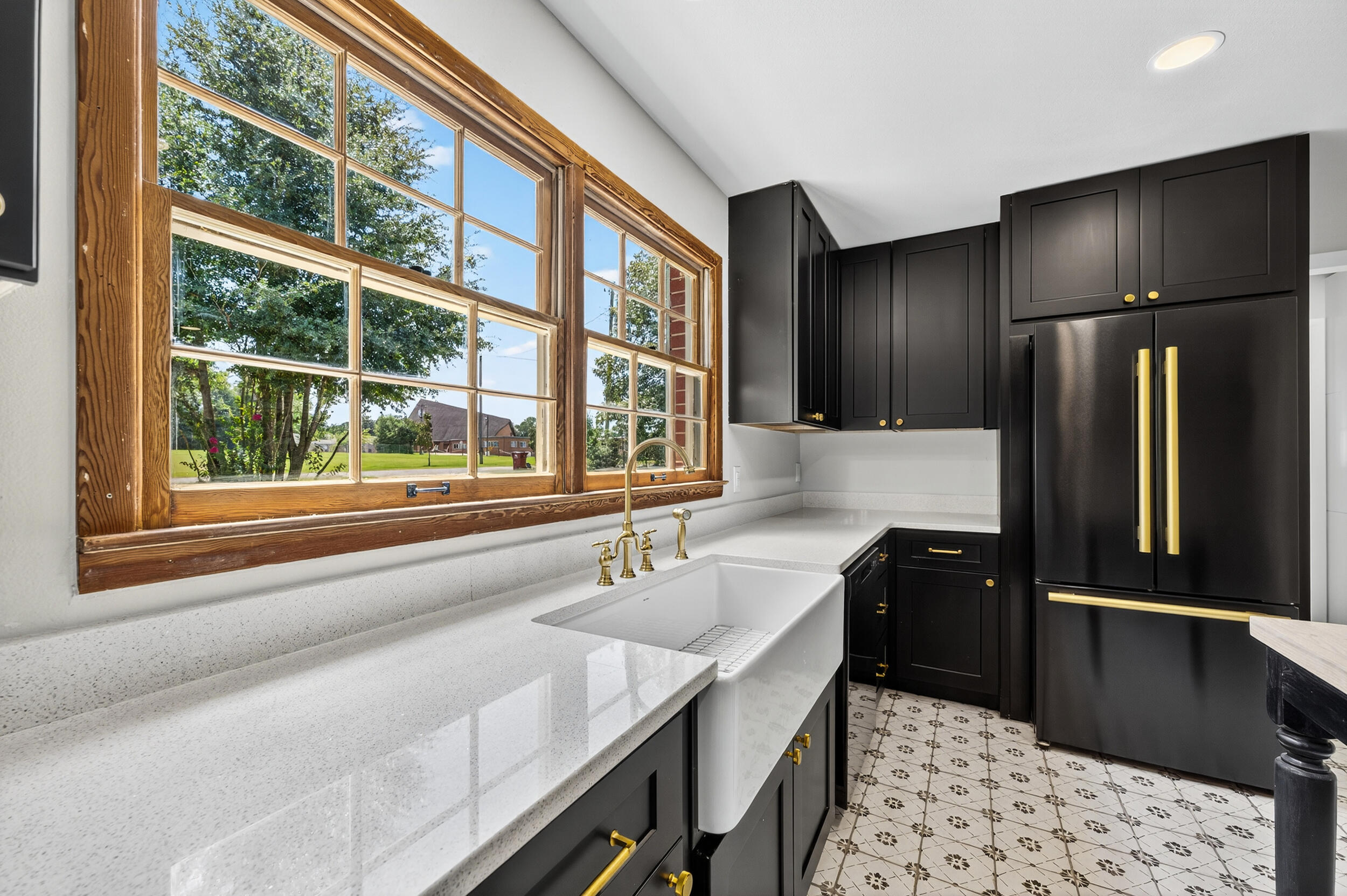 758 9th Avenue Crestview, FL 32536 - Photo 17 of 55 a kitchen with a refrigerator and a sink