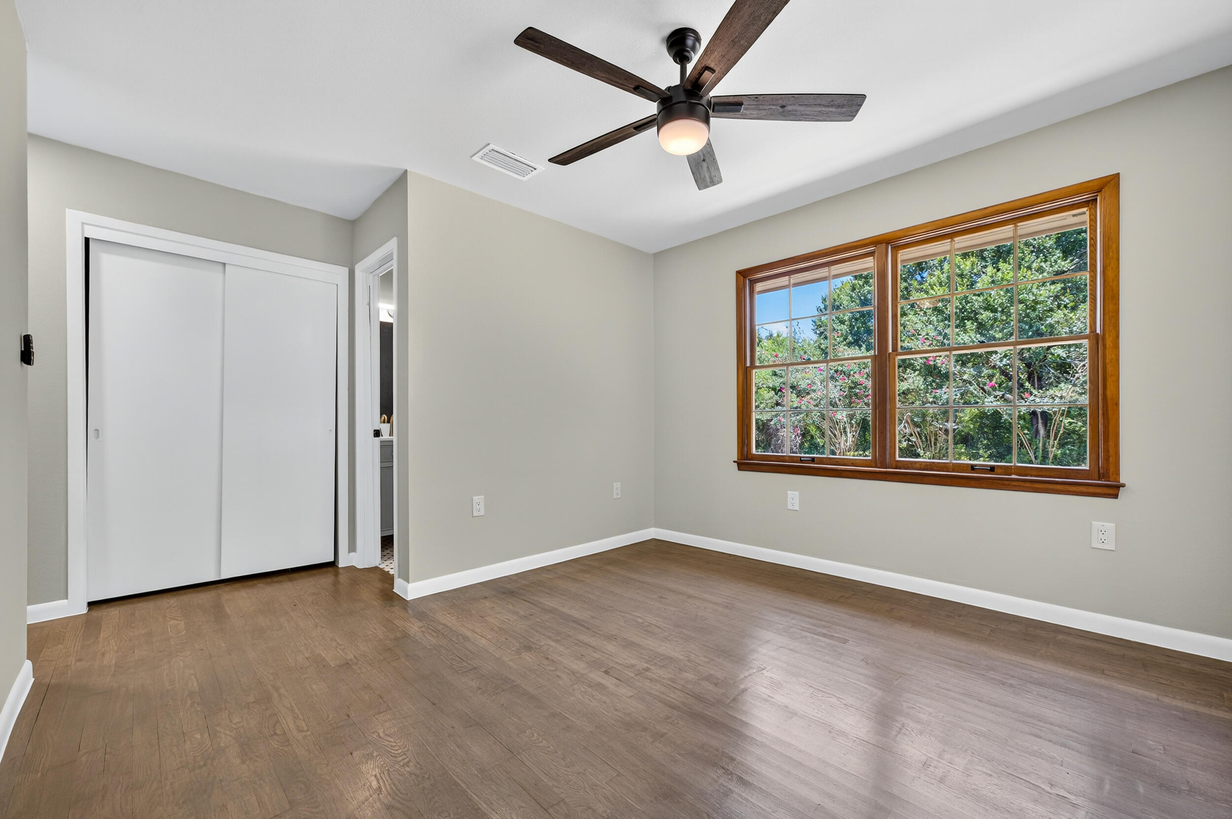758 9th Avenue Crestview, FL 32536 - Photo 27 of 55 wooden floor in an empty room with a window