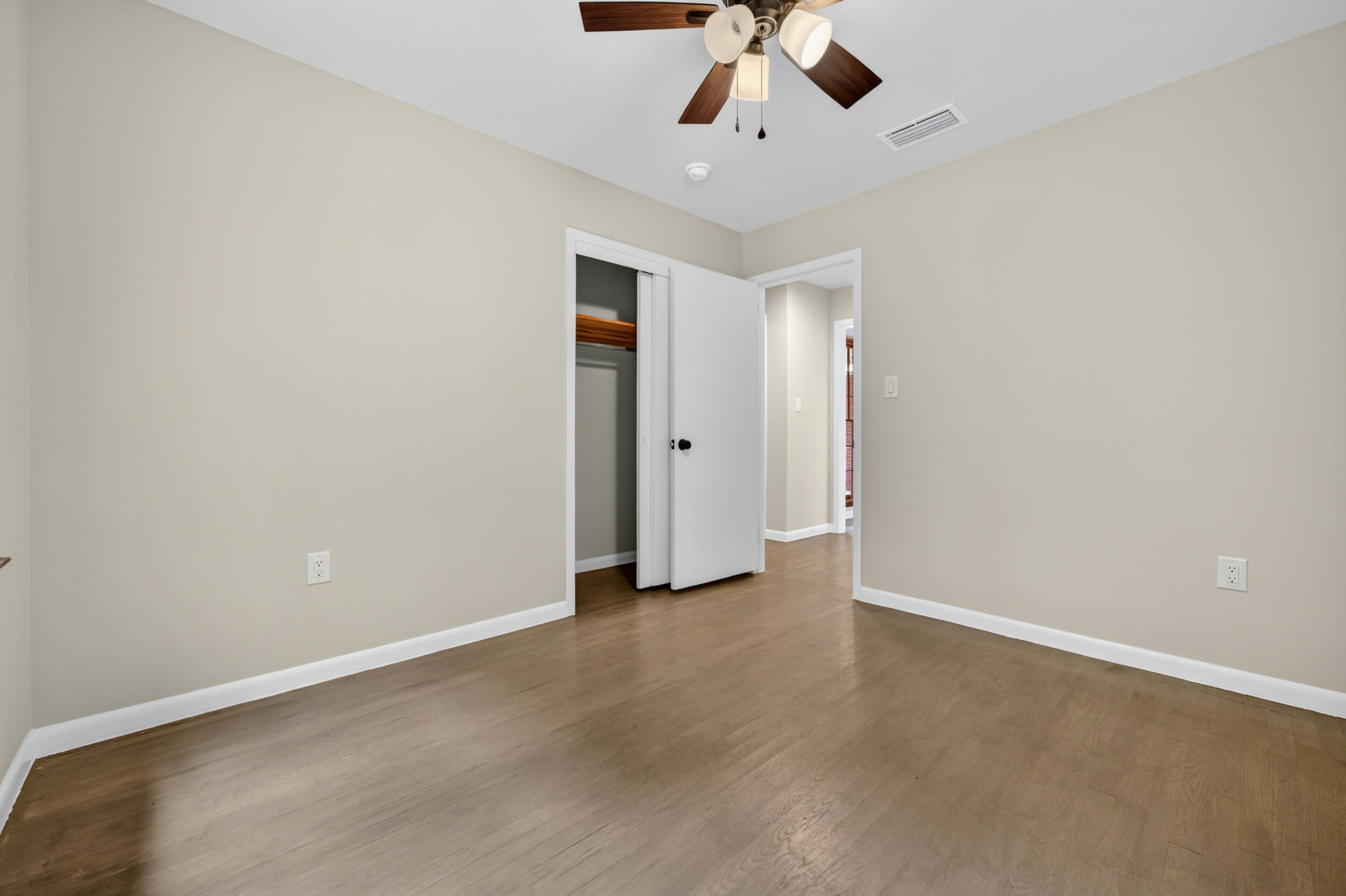 758 9th Avenue Crestview, FL 32536 - Photo 32 of 55 an empty room with a ceiling fan and carpet