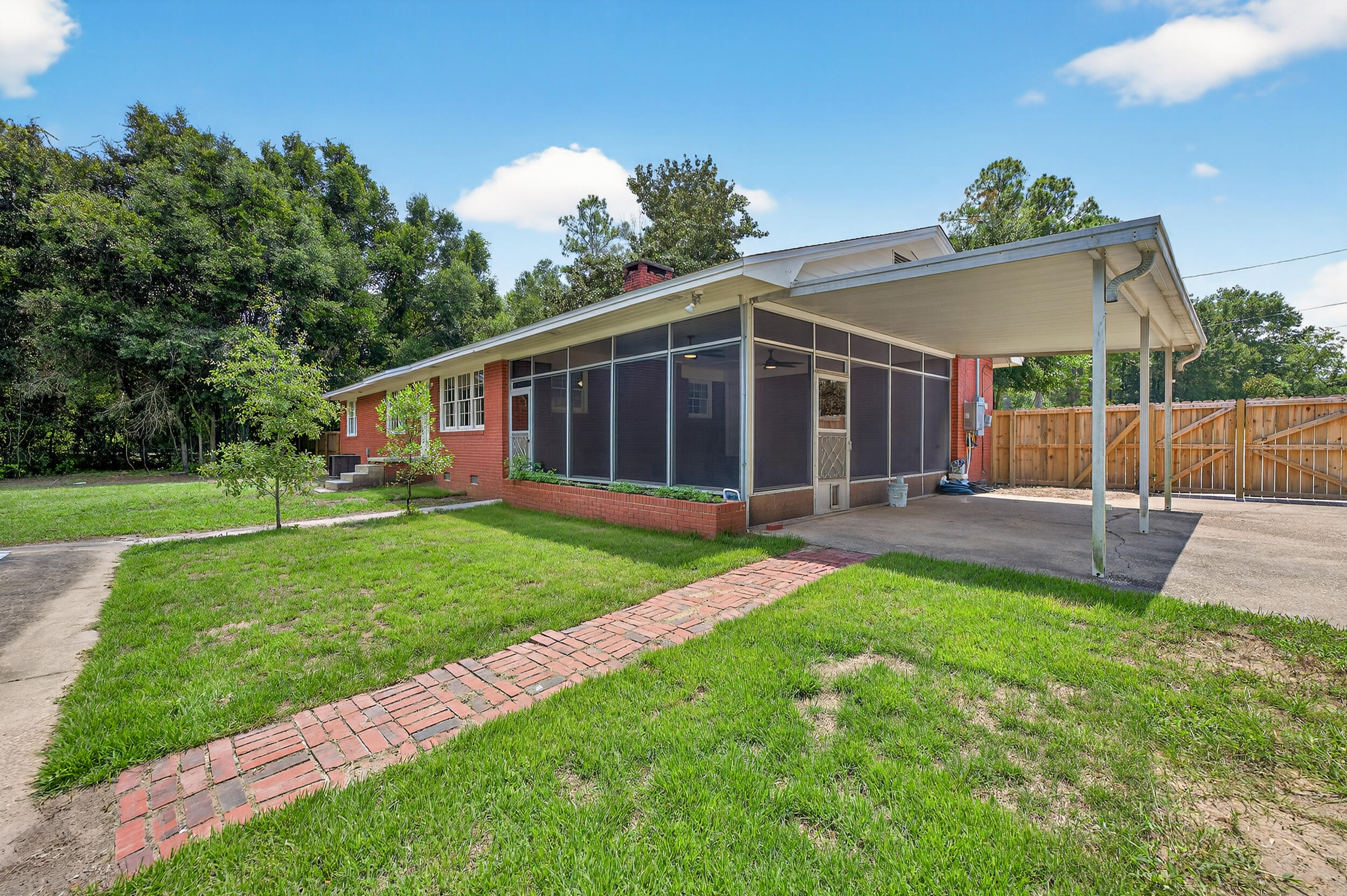 758 9th Avenue Crestview, FL 32536 - Photo 43 of 55 a view of a house with a yard and sitting area