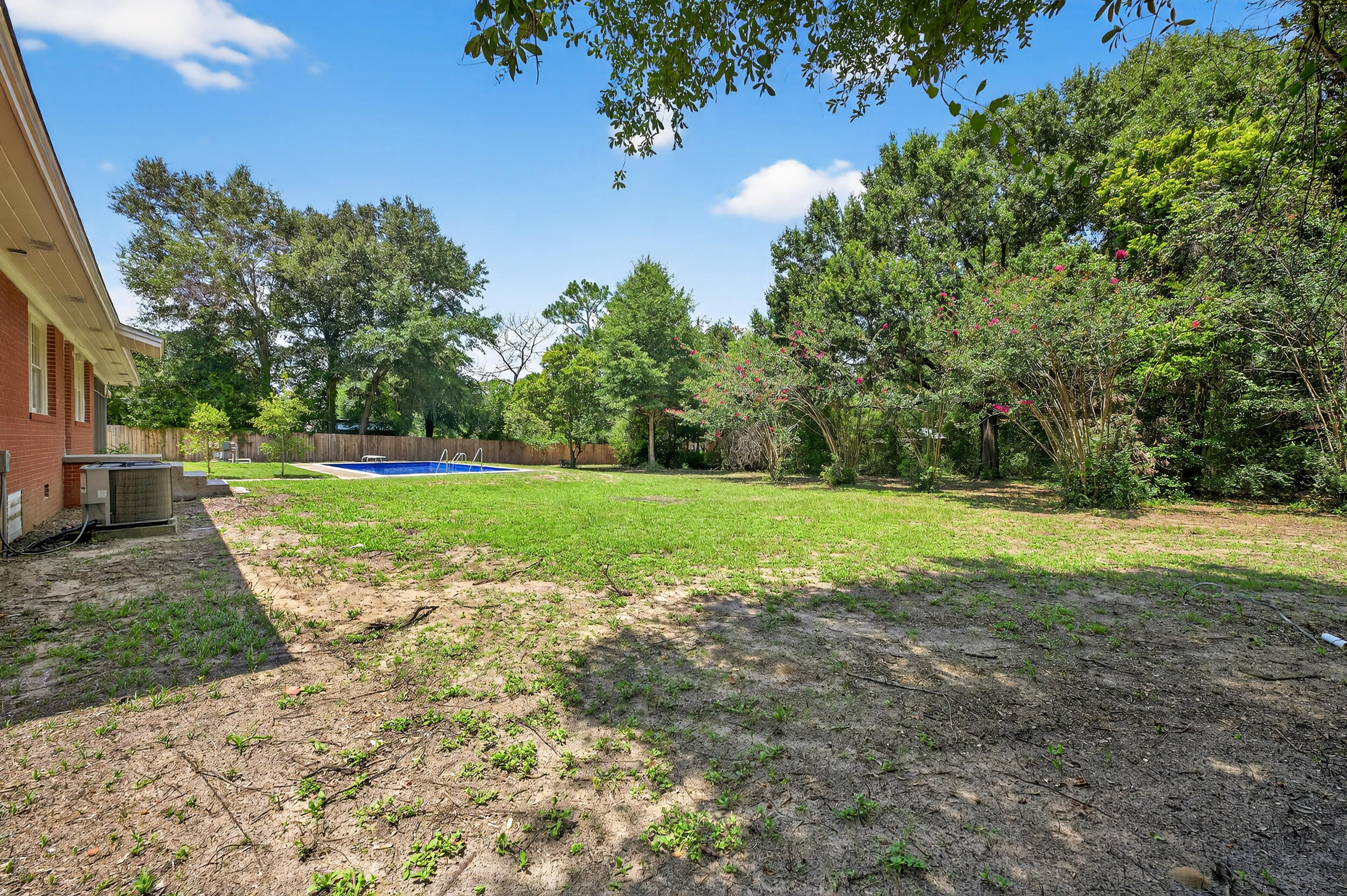 758 9th Avenue Crestview, FL 32536 - Photo 46 of 55 a view of a garden with large trees