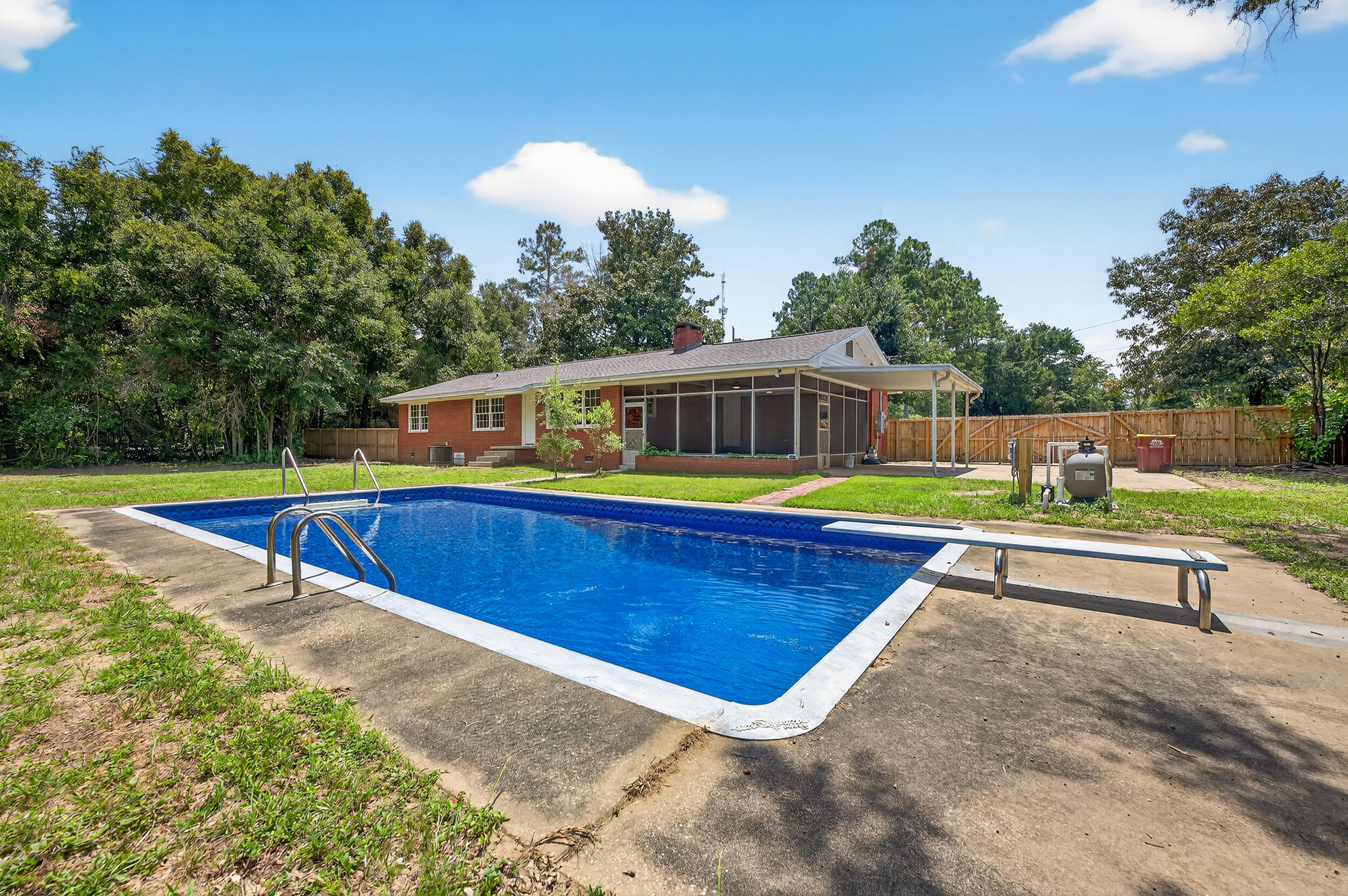 758 9th Avenue Crestview, FL 32536 - Photo 47 of 55 a view of a swimming pool with a deck and a yard