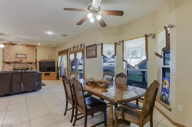 a dining room with furniture and window
