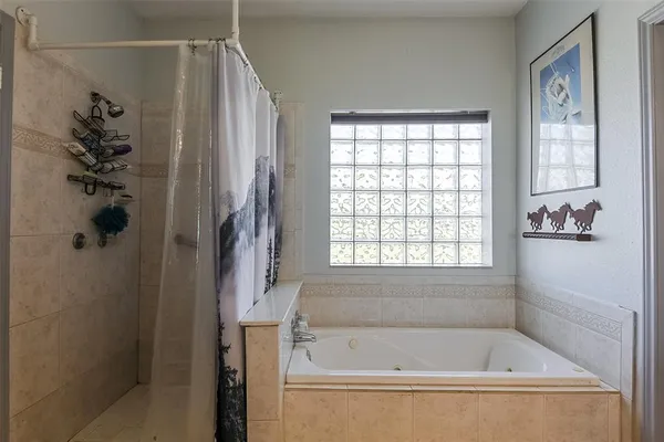 a white bath tub with a shower