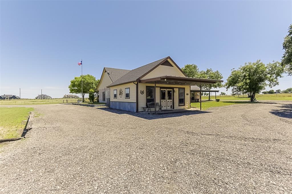 2403 Greathouse Road Waxahachie, TX 75167 - Photo 21 of 34 a front view of a house with a yard