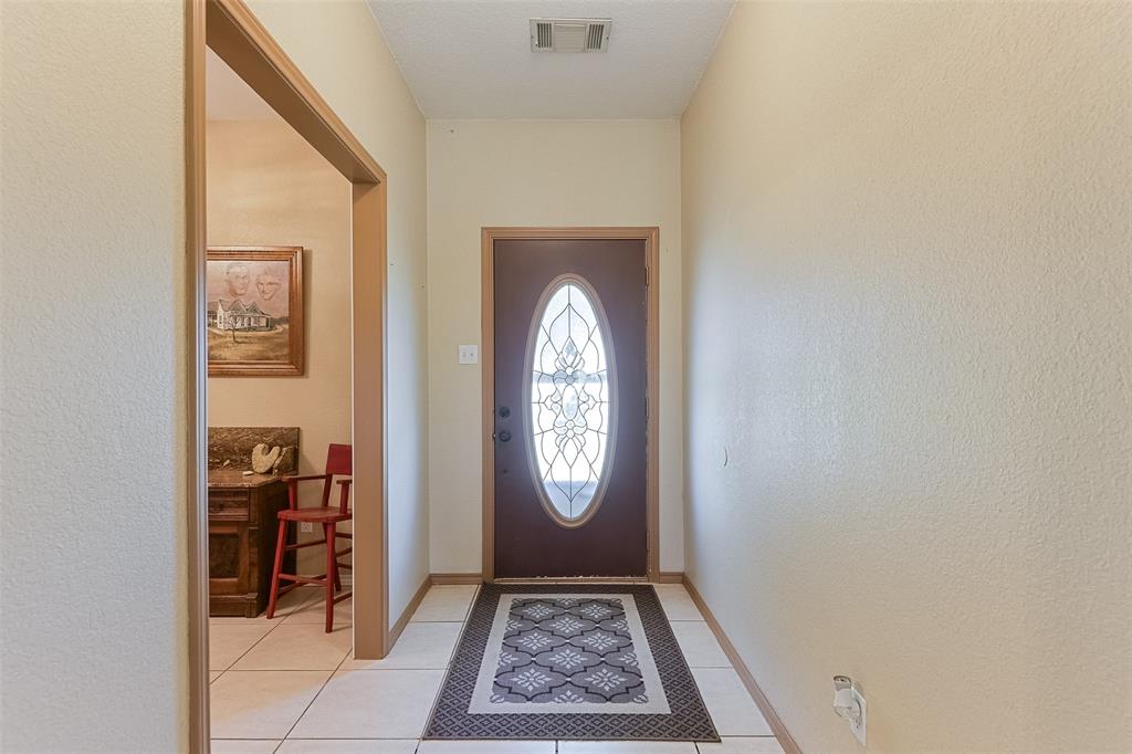 2403 Greathouse Road Waxahachie, TX 75167 - Photo 33 of 34 a view of an entryway with wooden floor