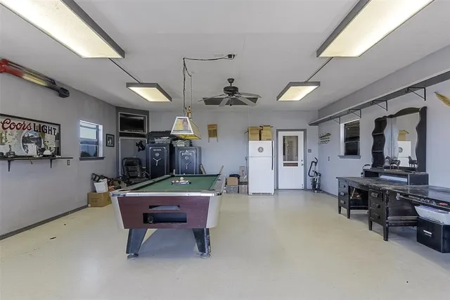a room with furniture and a pool table