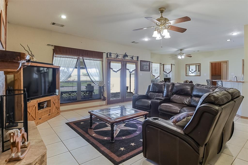 2403 Greathouse Road Waxahachie, TX 75167 - Photo 8 of 34 a living room with furniture and a floor to ceiling window