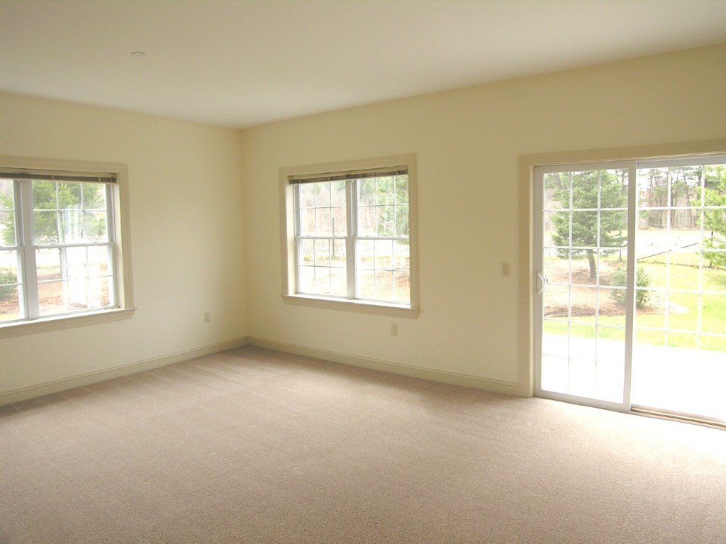 1 Abbott Lane, Unit 7 Concord, MA 01742 - Photo 7 of 10 an empty room with a window