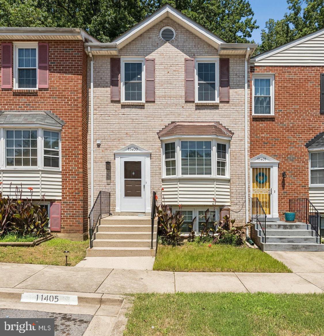 11400 Cosca Park Place Clinton, MD 20735 - Photo 1 of 22 a front view of a house with a yard