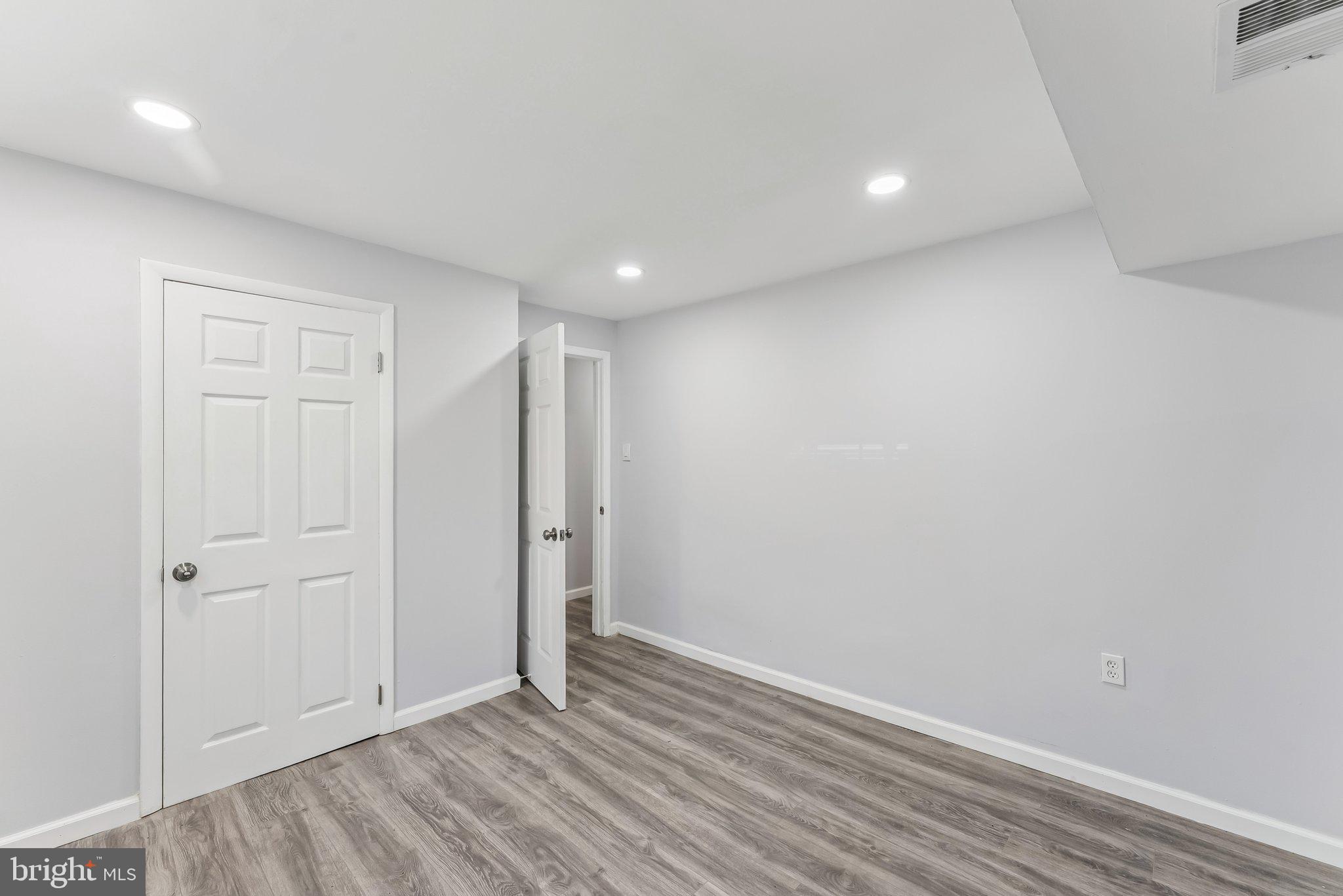 11400 Cosca Park Place Clinton, MD 20735 - Photo 16 of 22 a view of an empty room with wooden floor