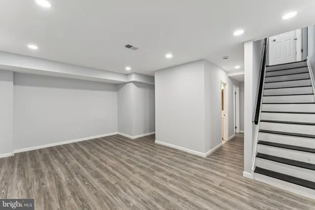 a view of entryway with wooden floor