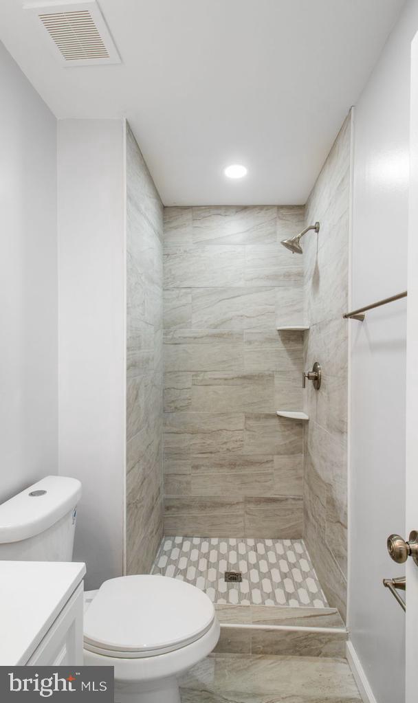 11400 Cosca Park Place Clinton, MD 20735 - Photo 20 of 22 a bathroom with a toilet and a shower