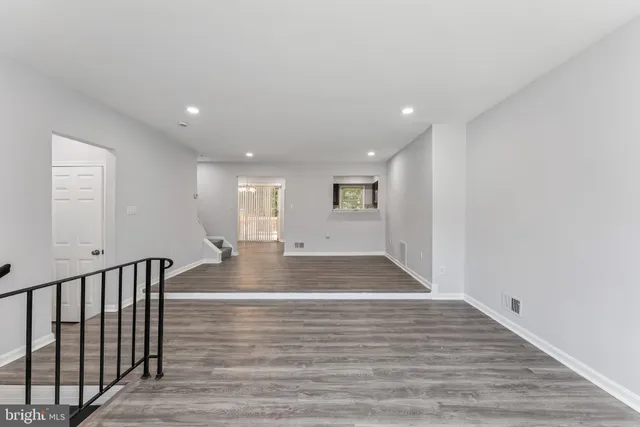 a view of outdoor space with wooden floor and window