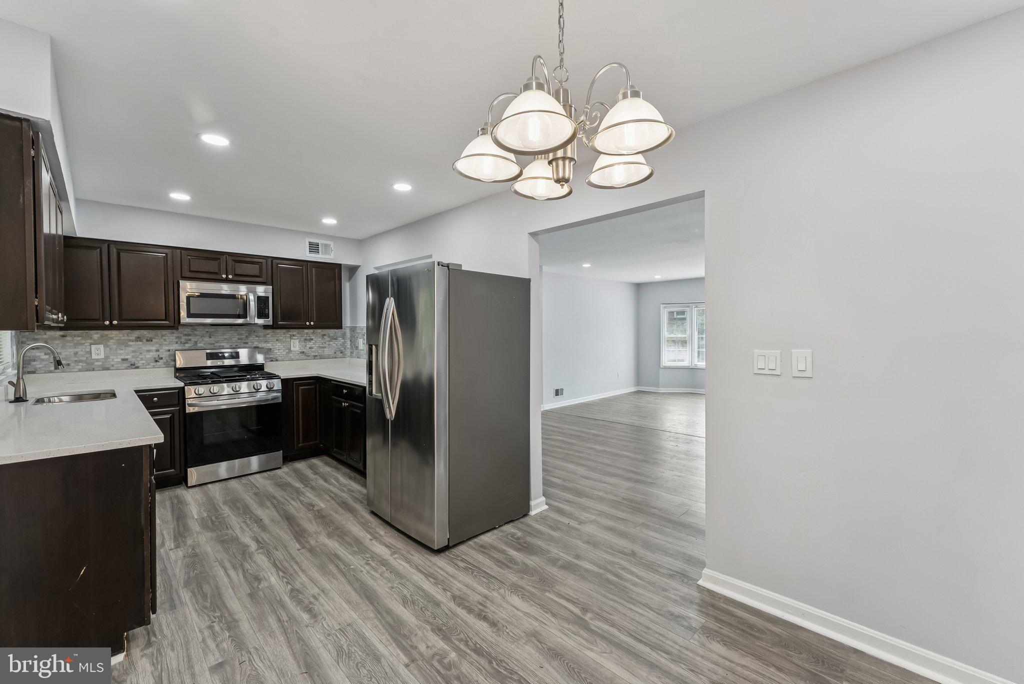11400 Cosca Park Place Clinton, MD 20735 - Photo 5 of 22 a kitchen with a refrigerator and a sink