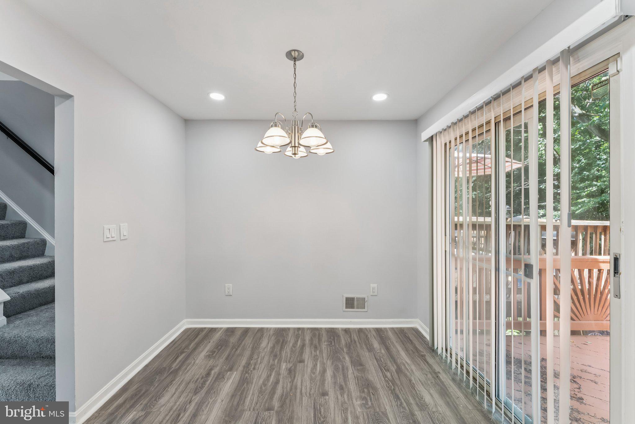 11400 Cosca Park Place Clinton, MD 20735 - Photo 6 of 22 a view of a room with wooden floor and windows