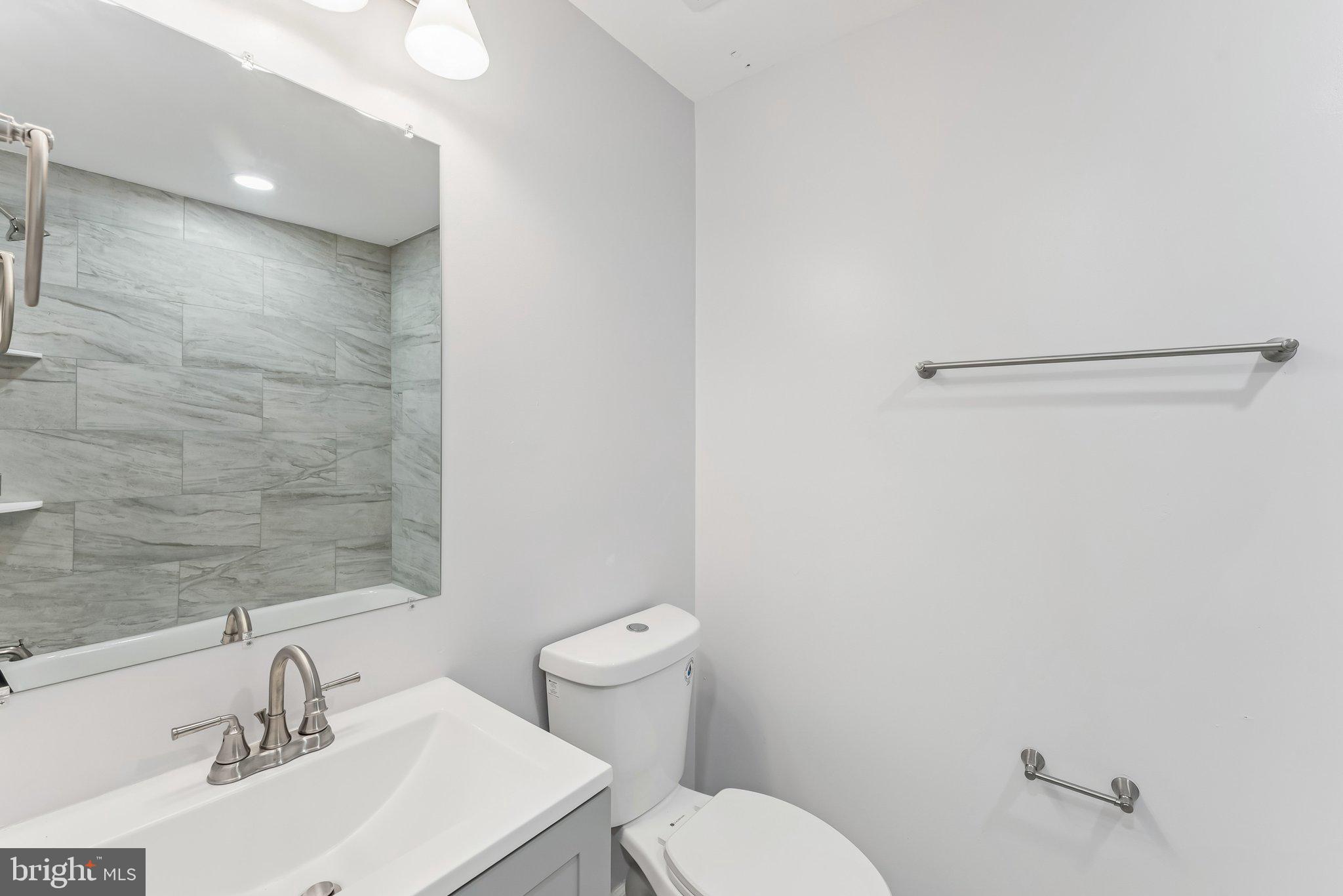 11400 Cosca Park Place Clinton, MD 20735 - Photo 10 of 22 a bathroom with a sink a toilet and shower