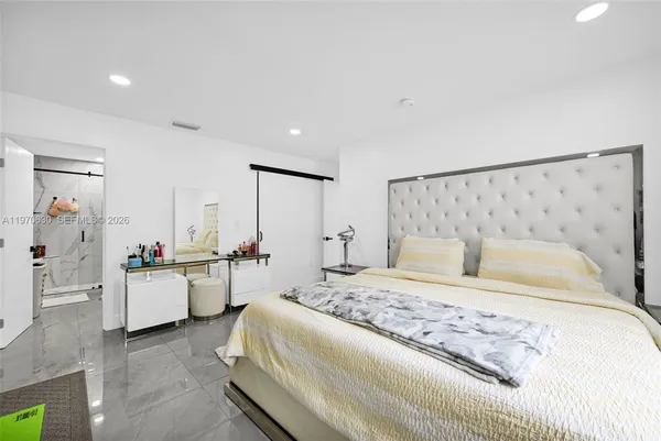 a bed room with a bed and a couch