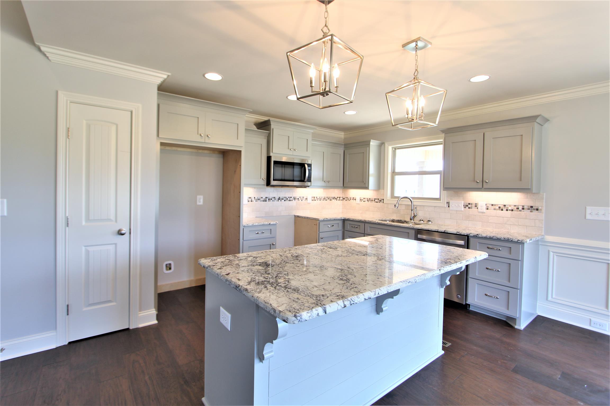 6620 Murfreesboro Road, Unit 29 Lebanon, TN 37090 - Photo 7 of 23 a kitchen with stainless steel appliances granite countertop a sink stove and refrigerator